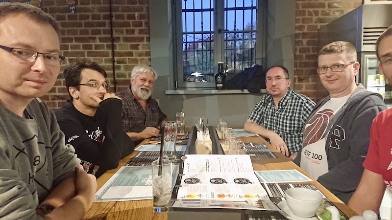 Six ISC staffers/friends sitting at a restaurant table